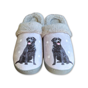 a pair of slippers with a black dog on them