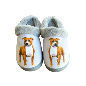 a pair of slippers with a dog on them