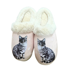 a pair of slippers with a cat on them