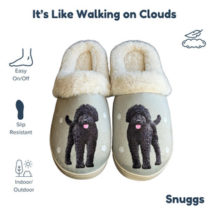 a pair of slippers with a black poodle on them