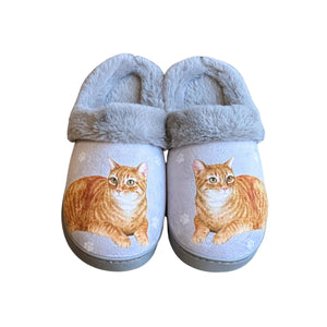 a pair of slippers with a cat on them